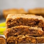 stacked blondies with butterfinger in the back.