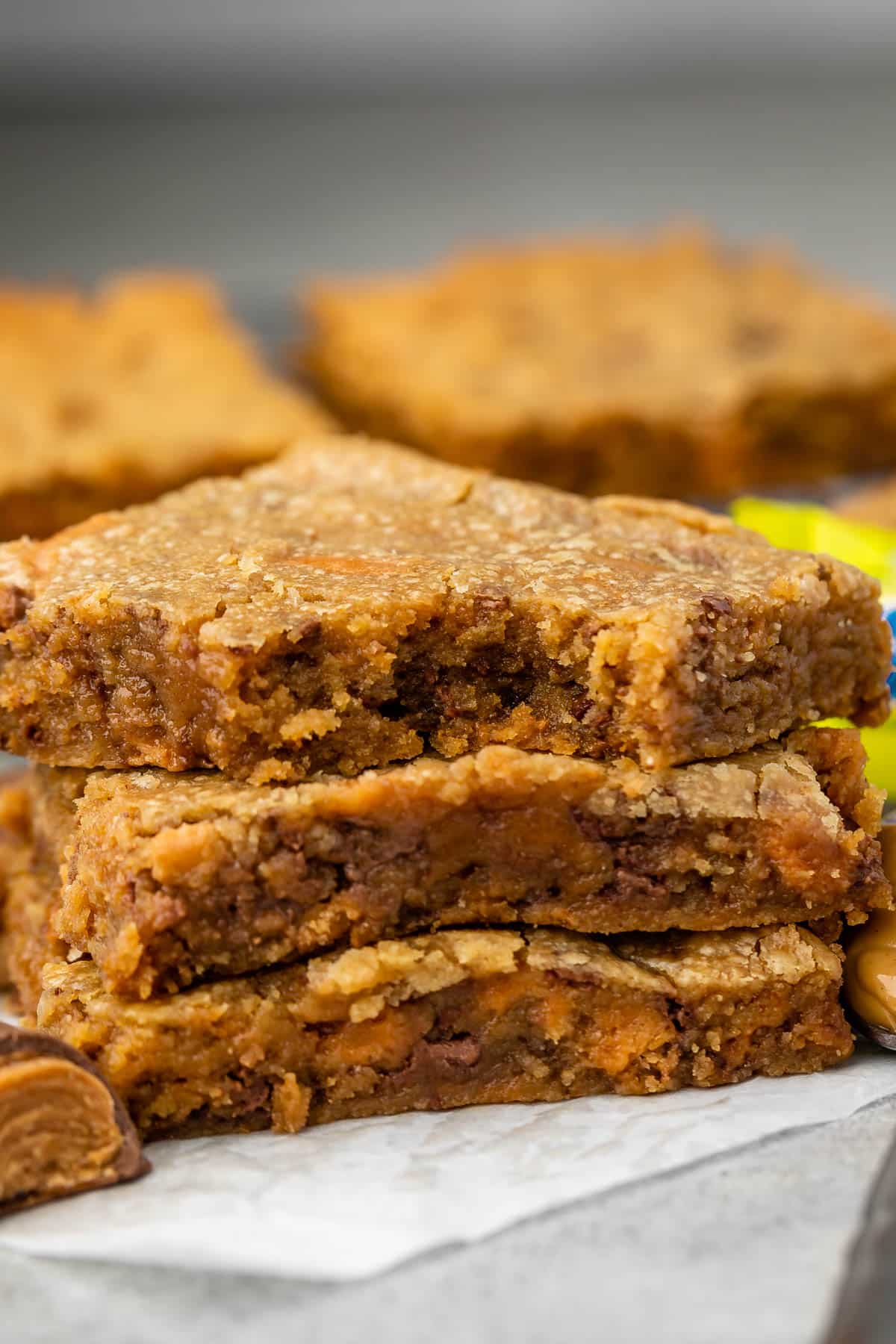 stacked blondies with butterfinger in the back.