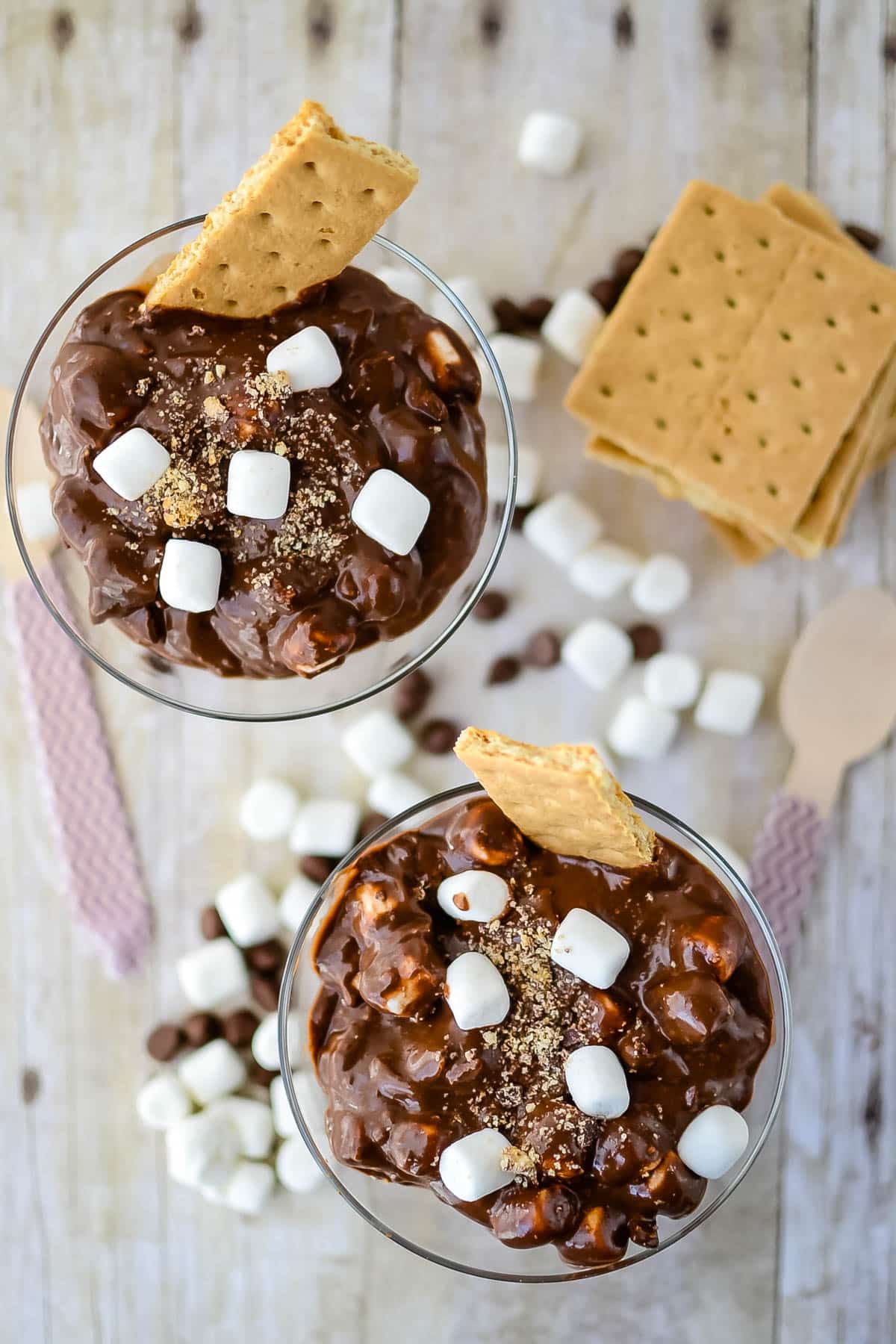 brown s'mores pudding with mini marshmallows and graham cracker in it.