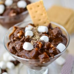 brown s'mores pudding with mini marshmallows and graham cracker in it.