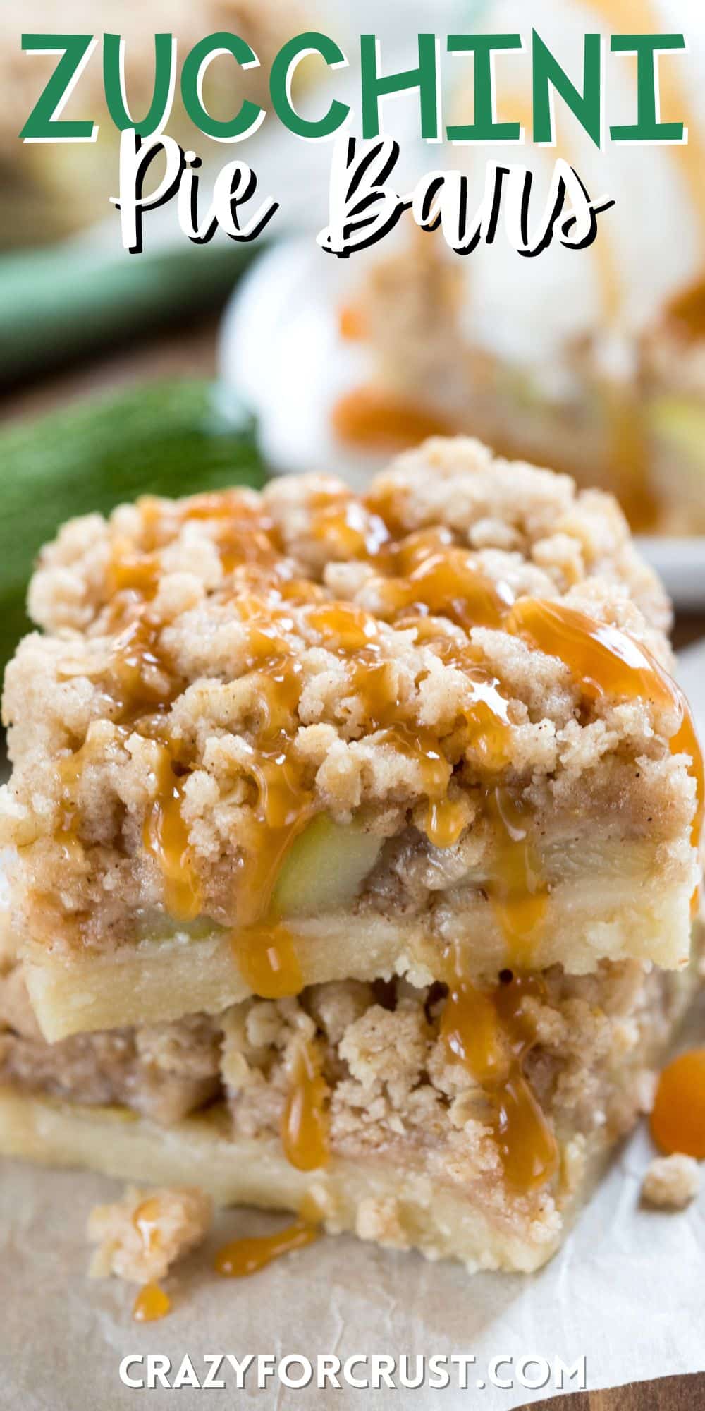 stacked zucchini bars with zucchini baked in and a crumble topping with words on the image.