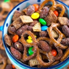 bowl of snack mix with pretzels and m&ms.