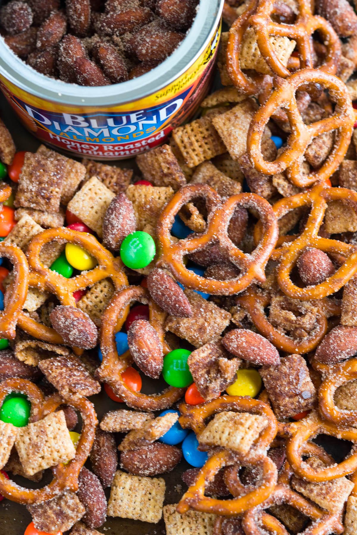 close up overhead shot of snack mix with blue diamond almond canister.