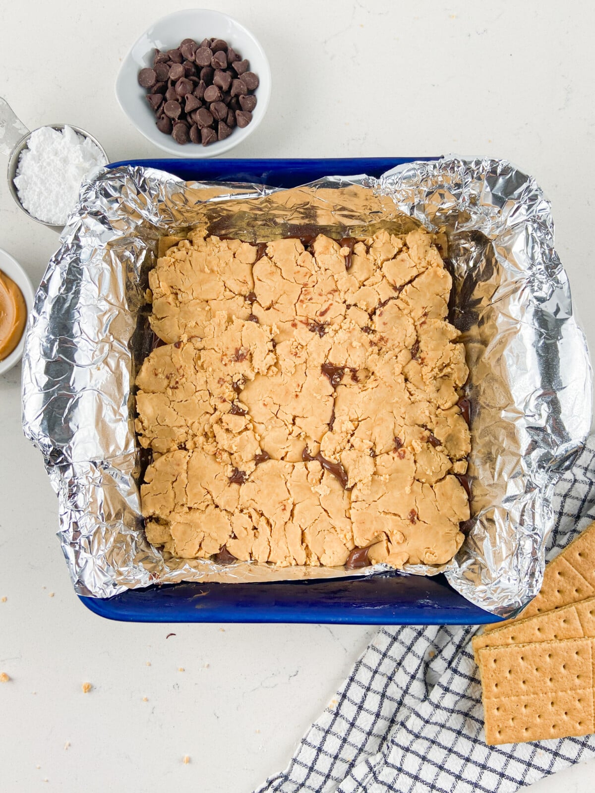 peanut butter mixture pressed into pan lined with foil