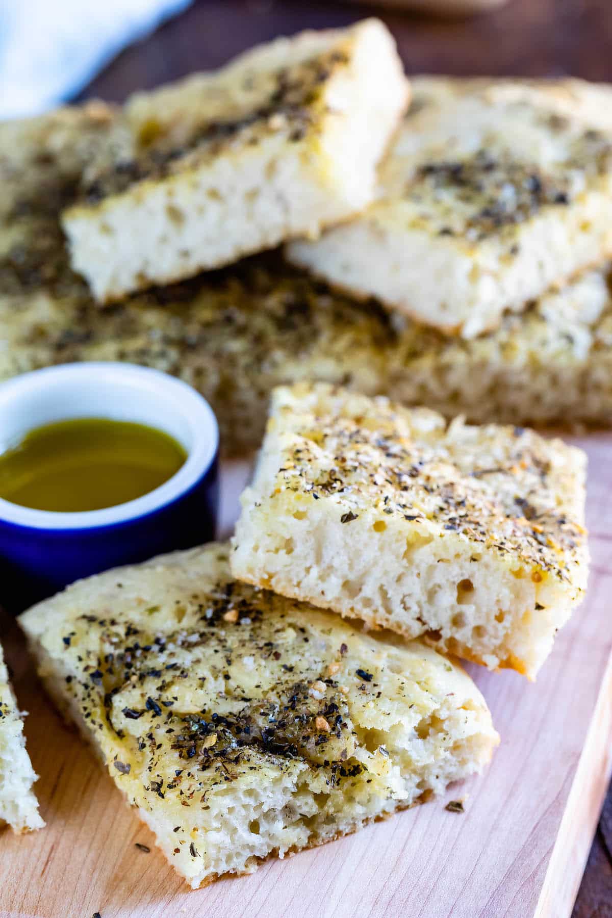 staked square slices of bread with oil and herbs on top.
