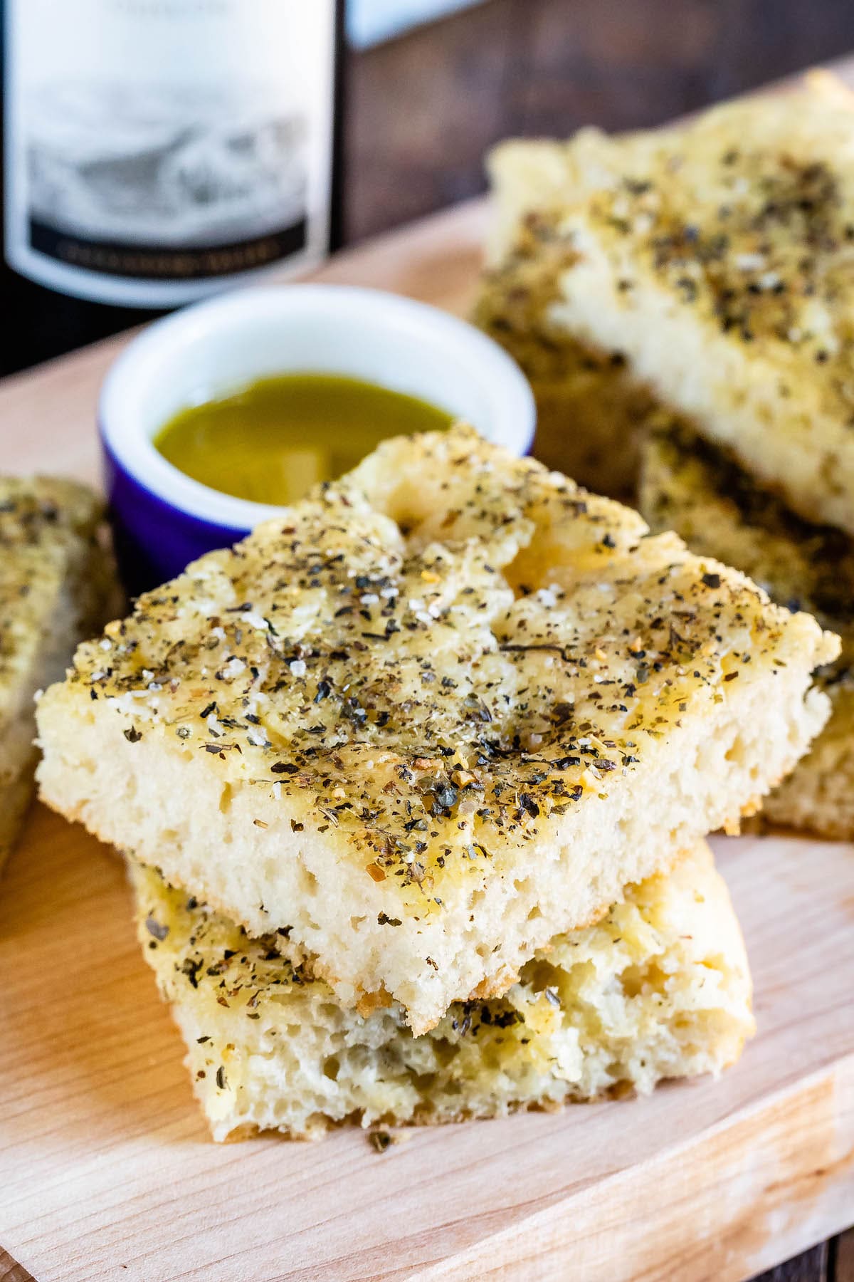 staked square slices of bread with oil and herbs on top.