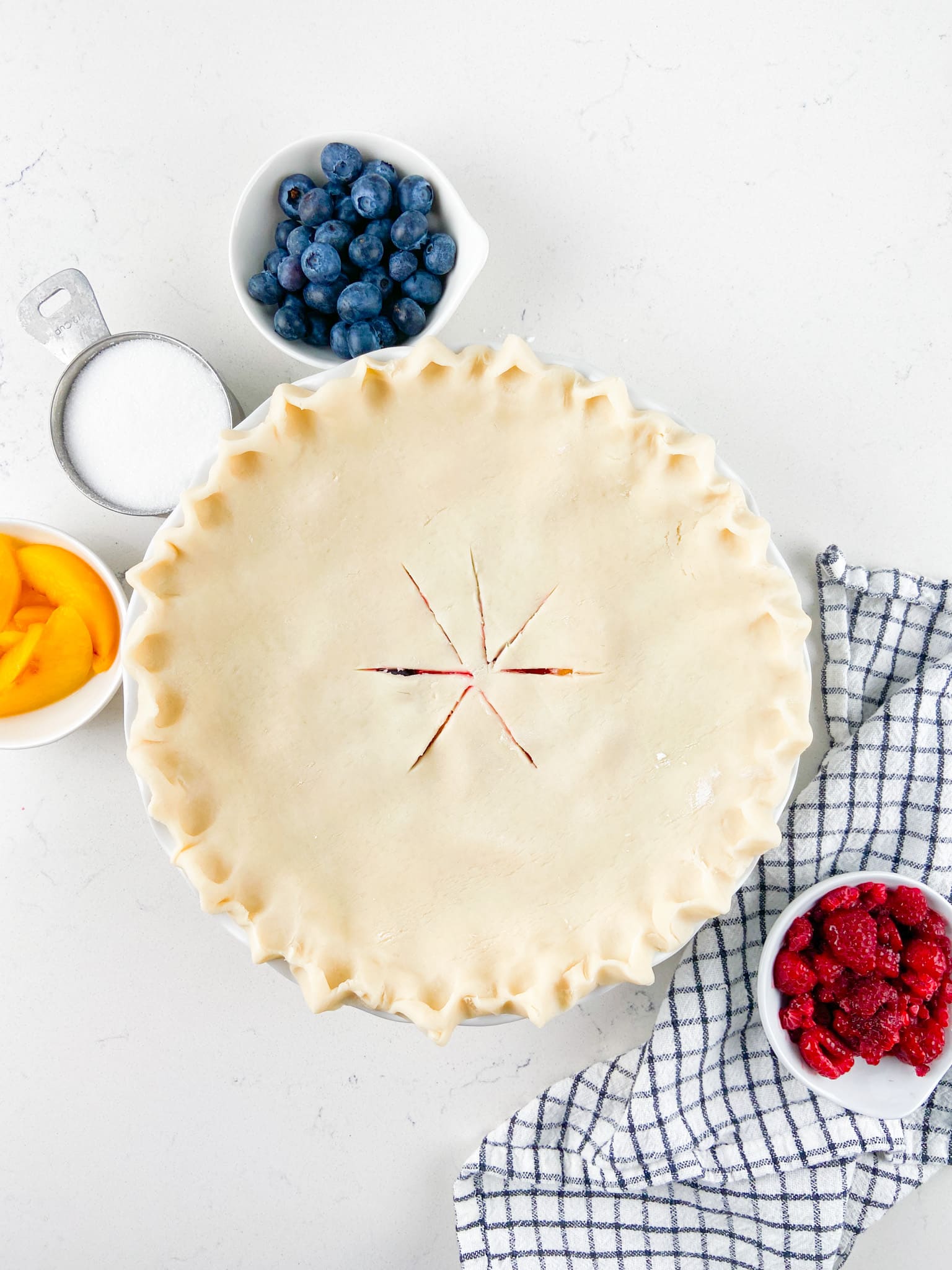 https://www.crazyforcrust.com/wp-content/uploads/2023/08/Raspberry-Peach-Blueberry-Pie-1.jpg