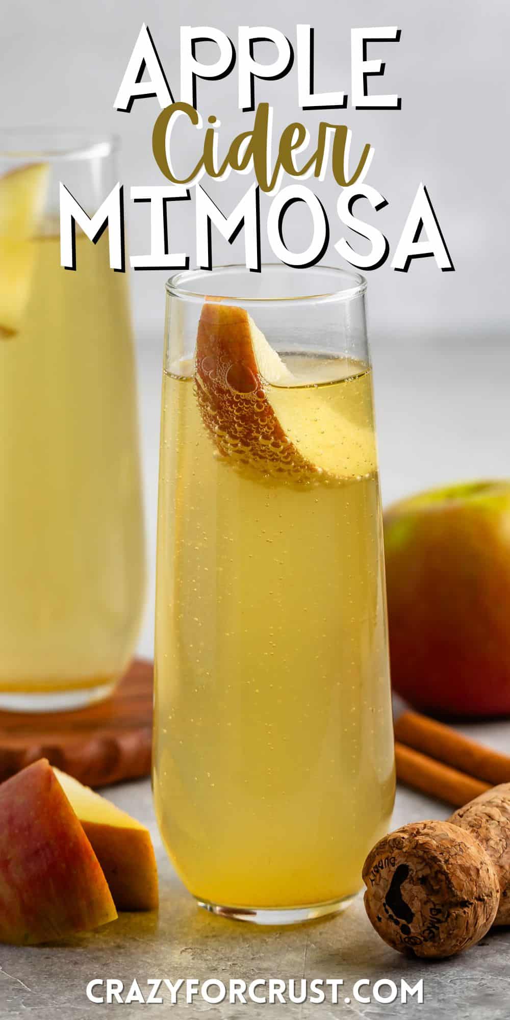 yellow drink in a tall clear glass with an apple slice in the glass with words on the image.