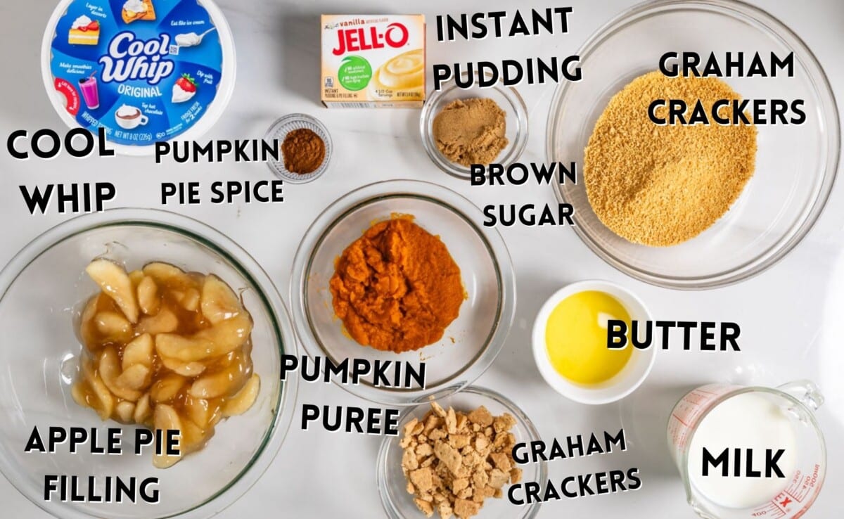 ingredients in apple pumpkin dessert laid out on a marble counter.