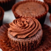 brownie cupcake with brown frosting.