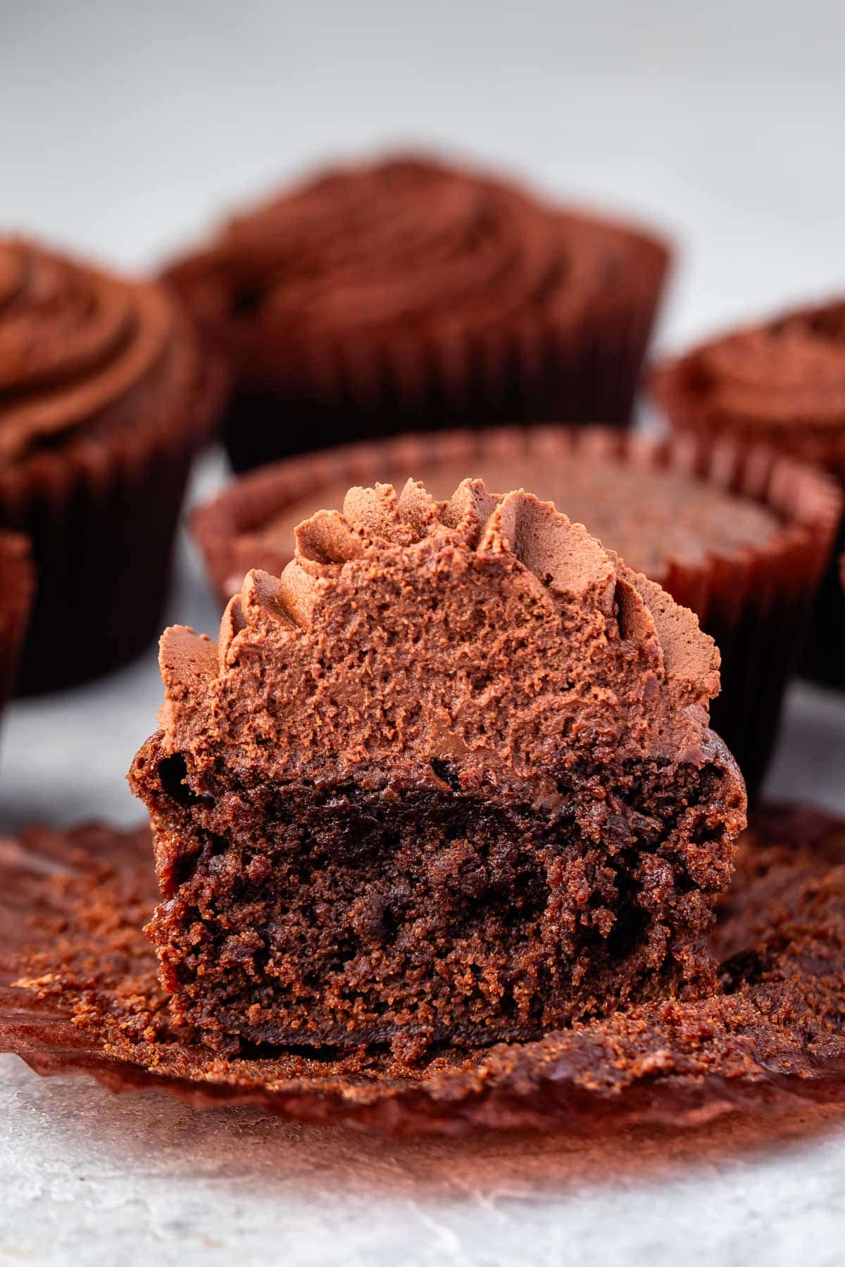 brownie cupcake with brown frosting.