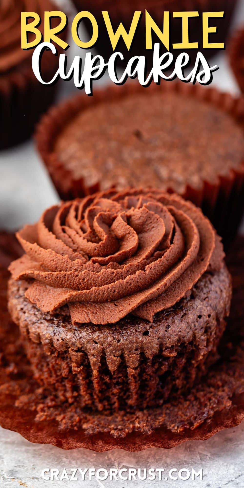 brownie cupcake with brown frosting with words on the image.