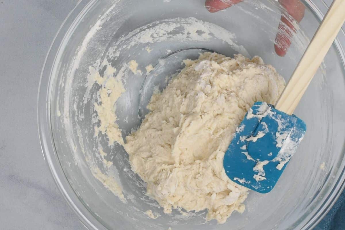 process shot of focaccia bread being made.