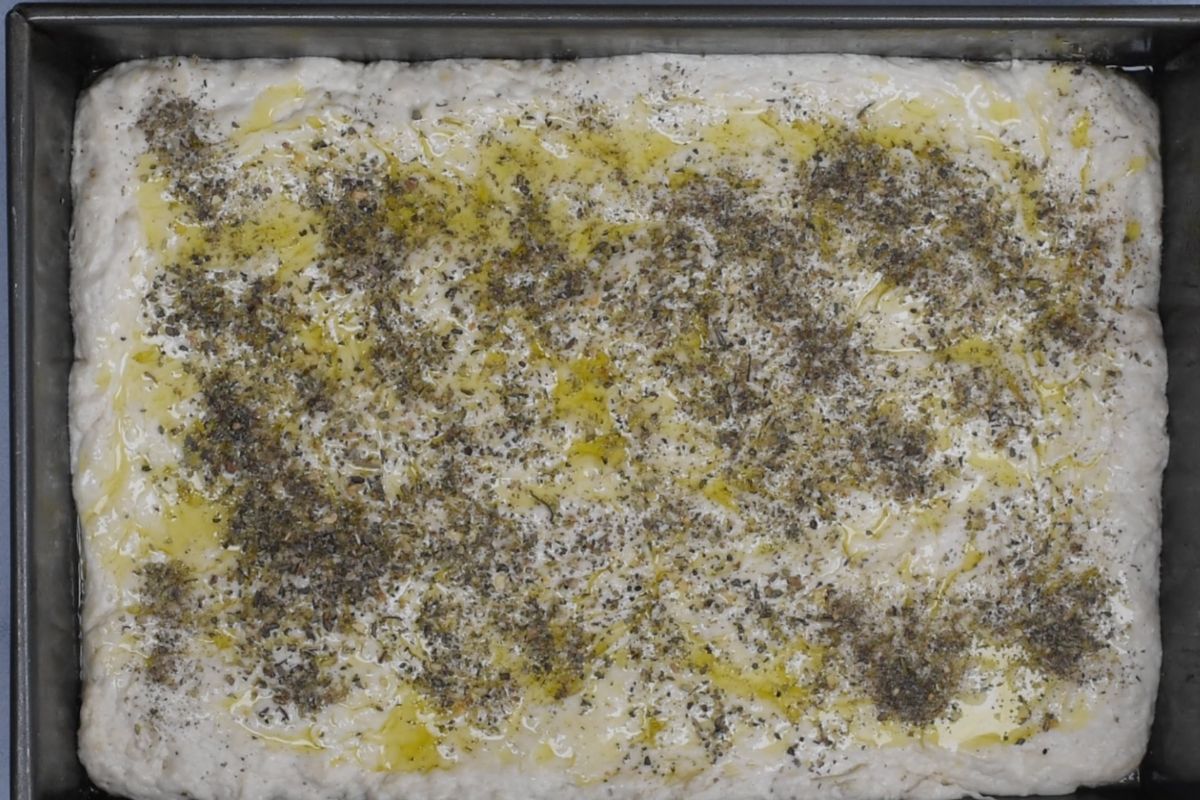 process shot of focaccia bread being made.