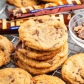 stacked cookies with heath bars baked in and around the cookies.