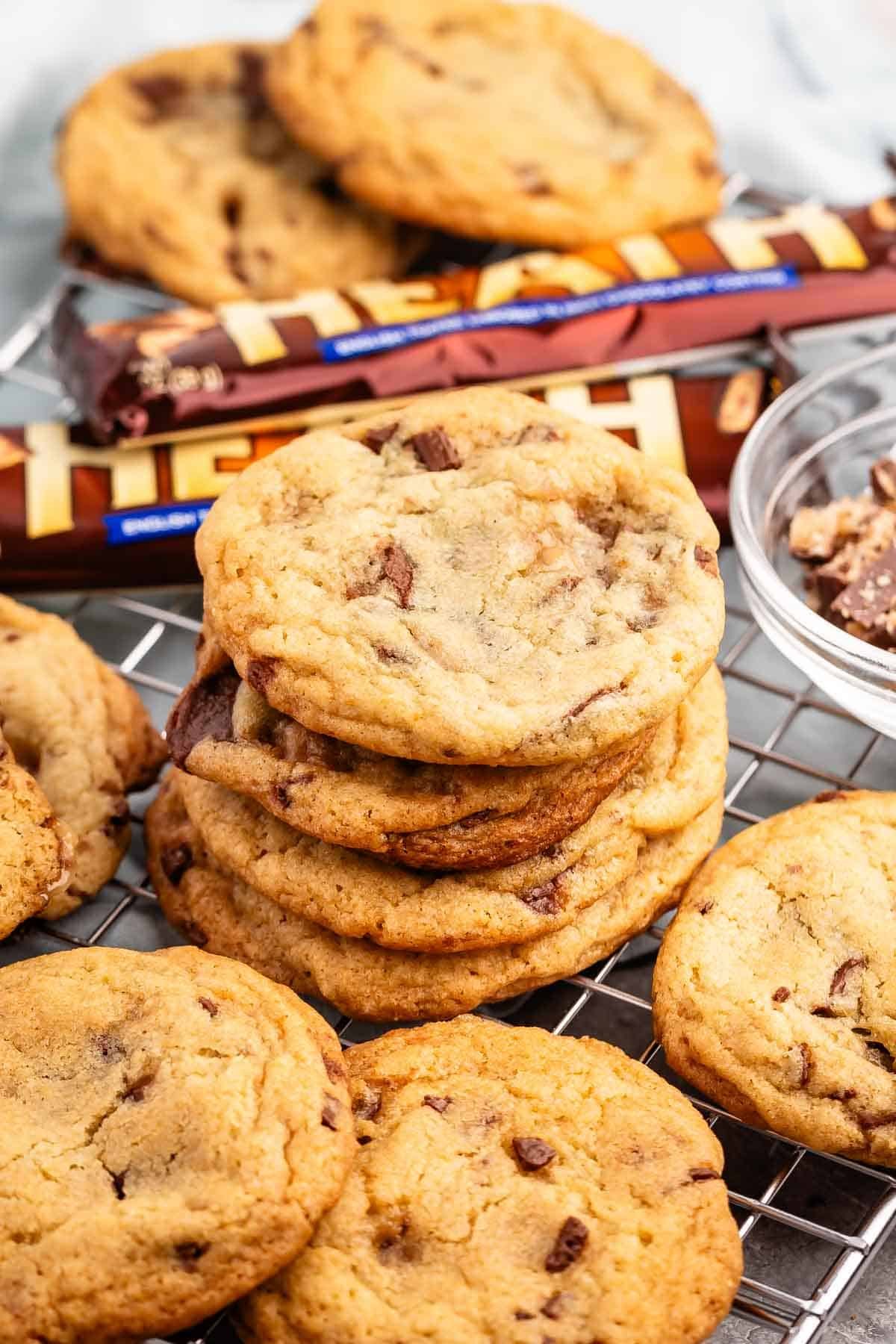 stacked cookies with heath bars baked in and around the cookies.