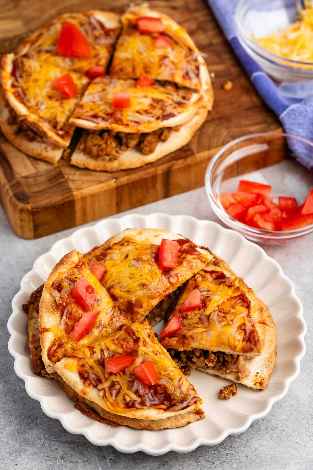 sliced mexican pizza on a white plate.