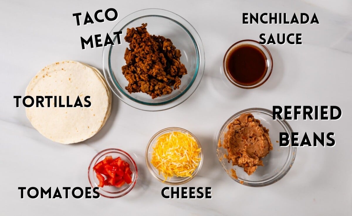 ingredients in mexican pizza laid out on a white counter.