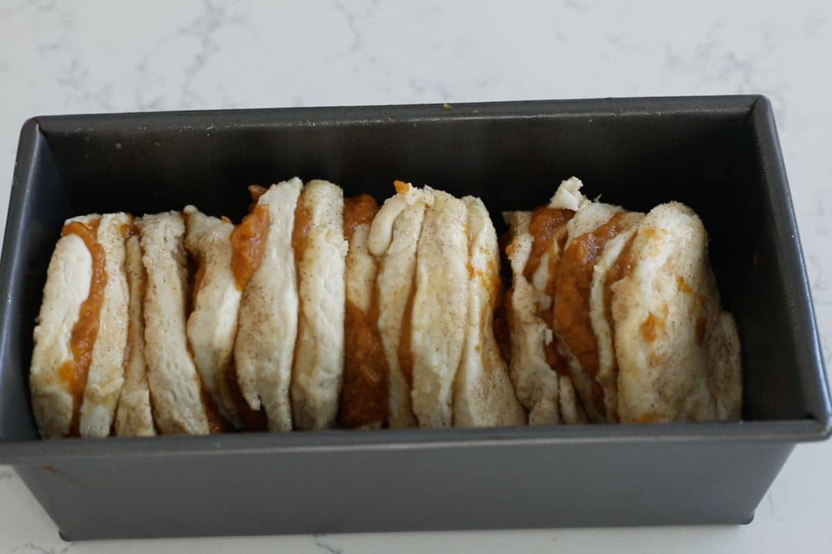 process shot of pumpkin pull apart loaf.