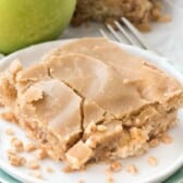 square slice of apple bar on a white plate.