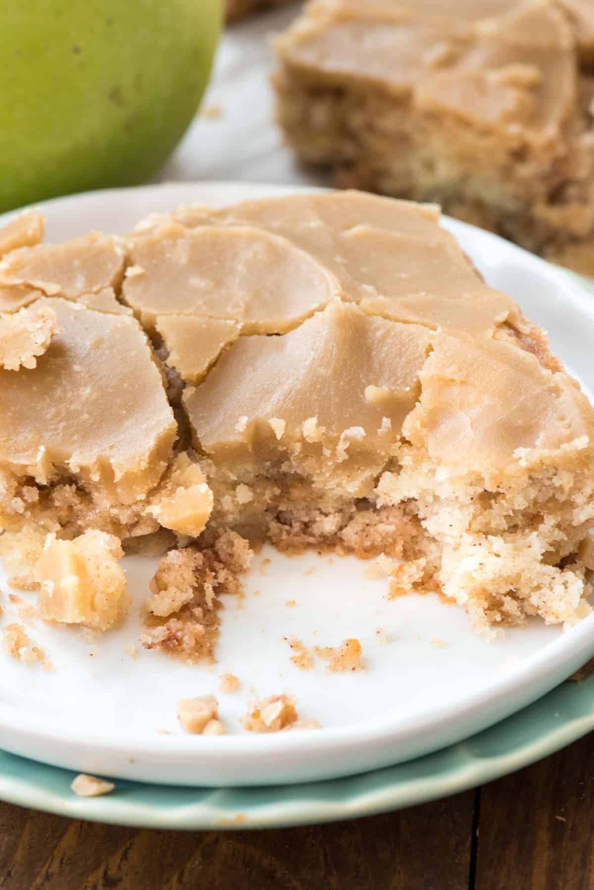 square slice of apple bar on a white plate.