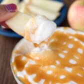 cheesecake dip with caramel drizzled on top.