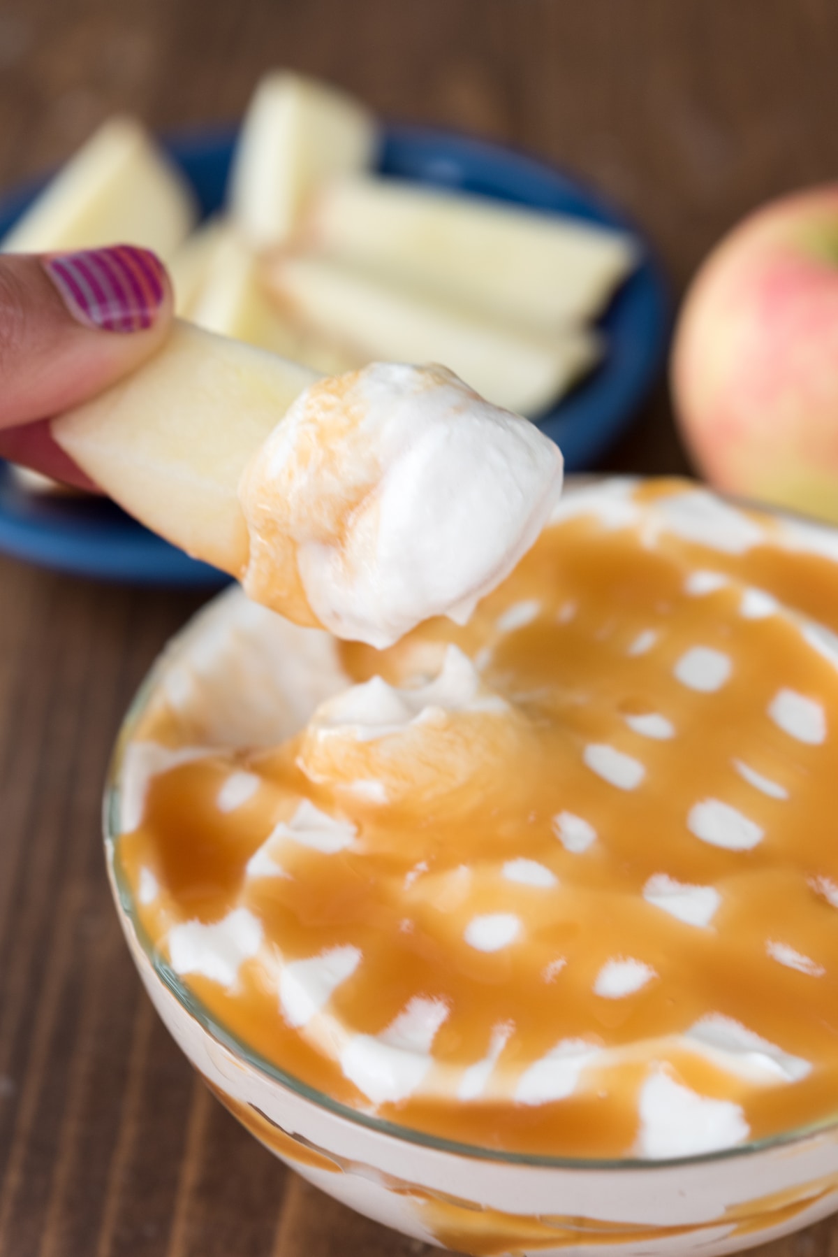 cheesecake dip with caramel drizzled on top.