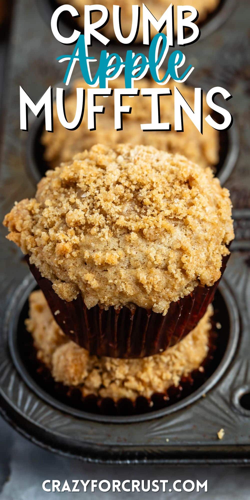 apple muffins in a brown cupcake tin with a crumble topping with words on the image.