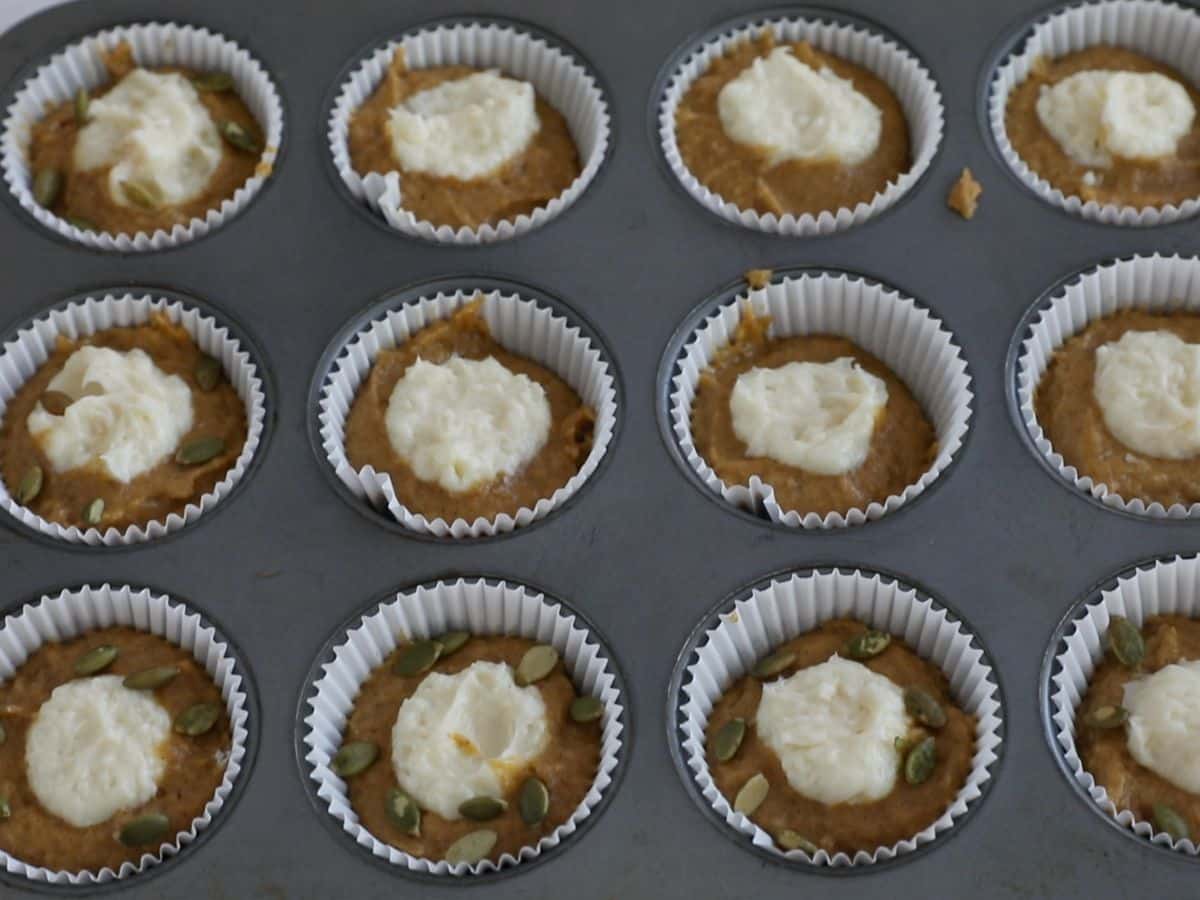 process shot of pumpkin cream cheese muffins.