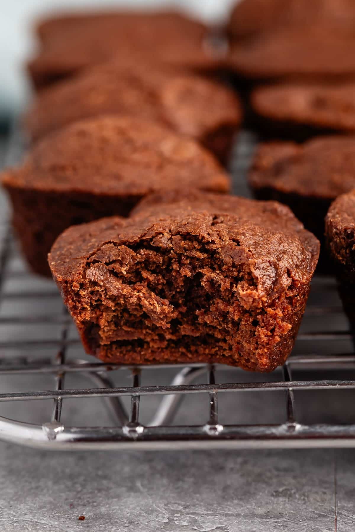 brownie bites layered on a drying wrack.