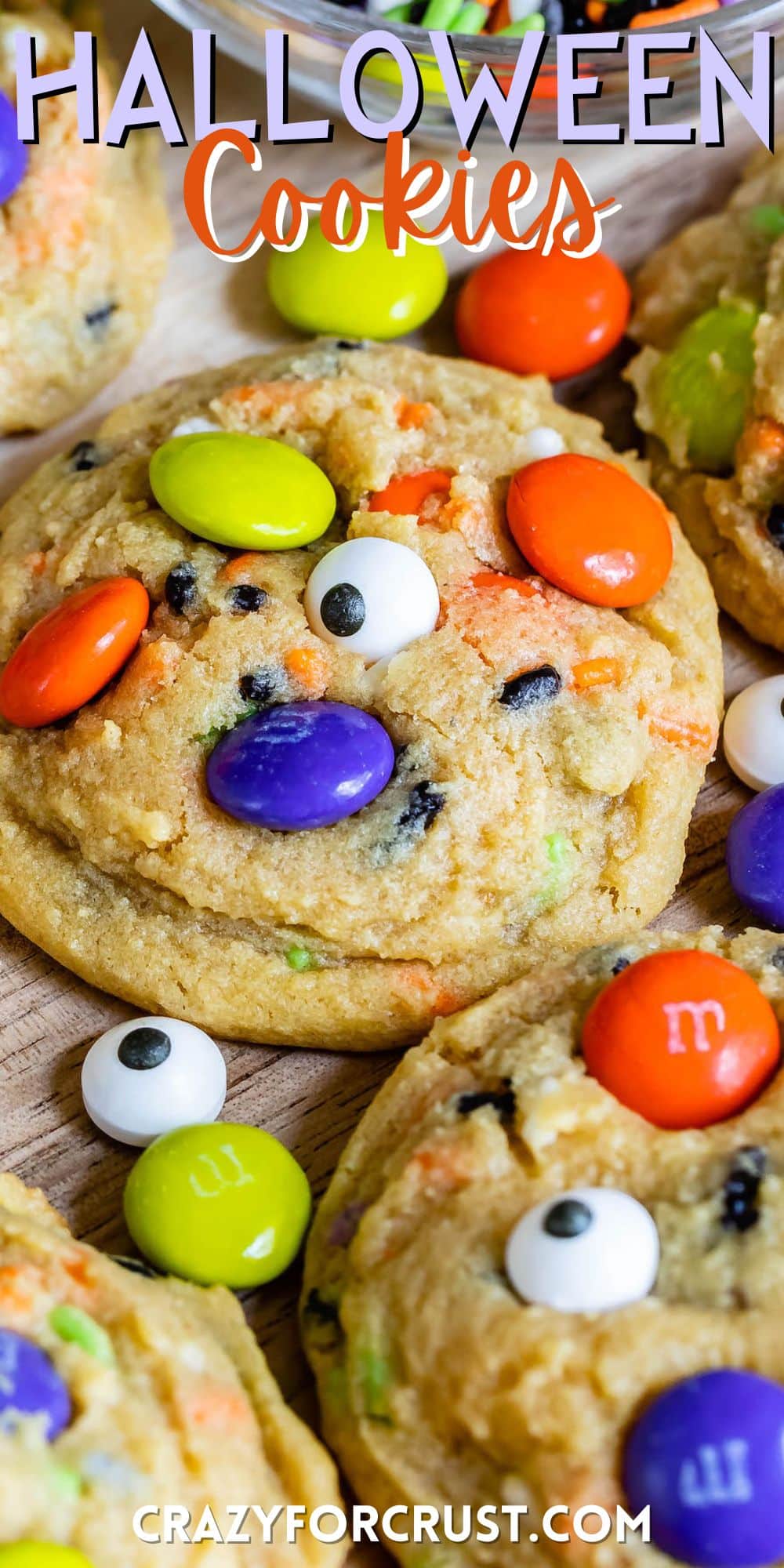 cookies with Halloween themed m&ms and sprinkles baked in with words on the image.
