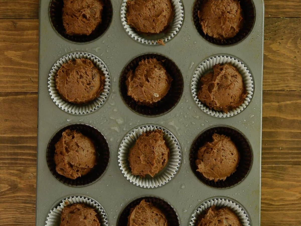 process shot of pumpkin brownie muffins.