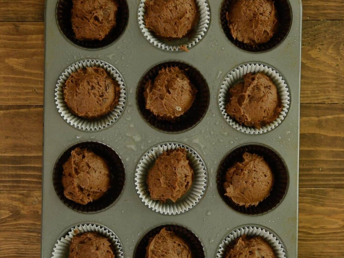 process shot of pumpkin brownie muffins.