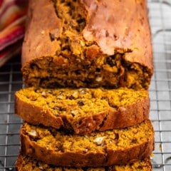 sliced bread on a rack with nuts baked in.