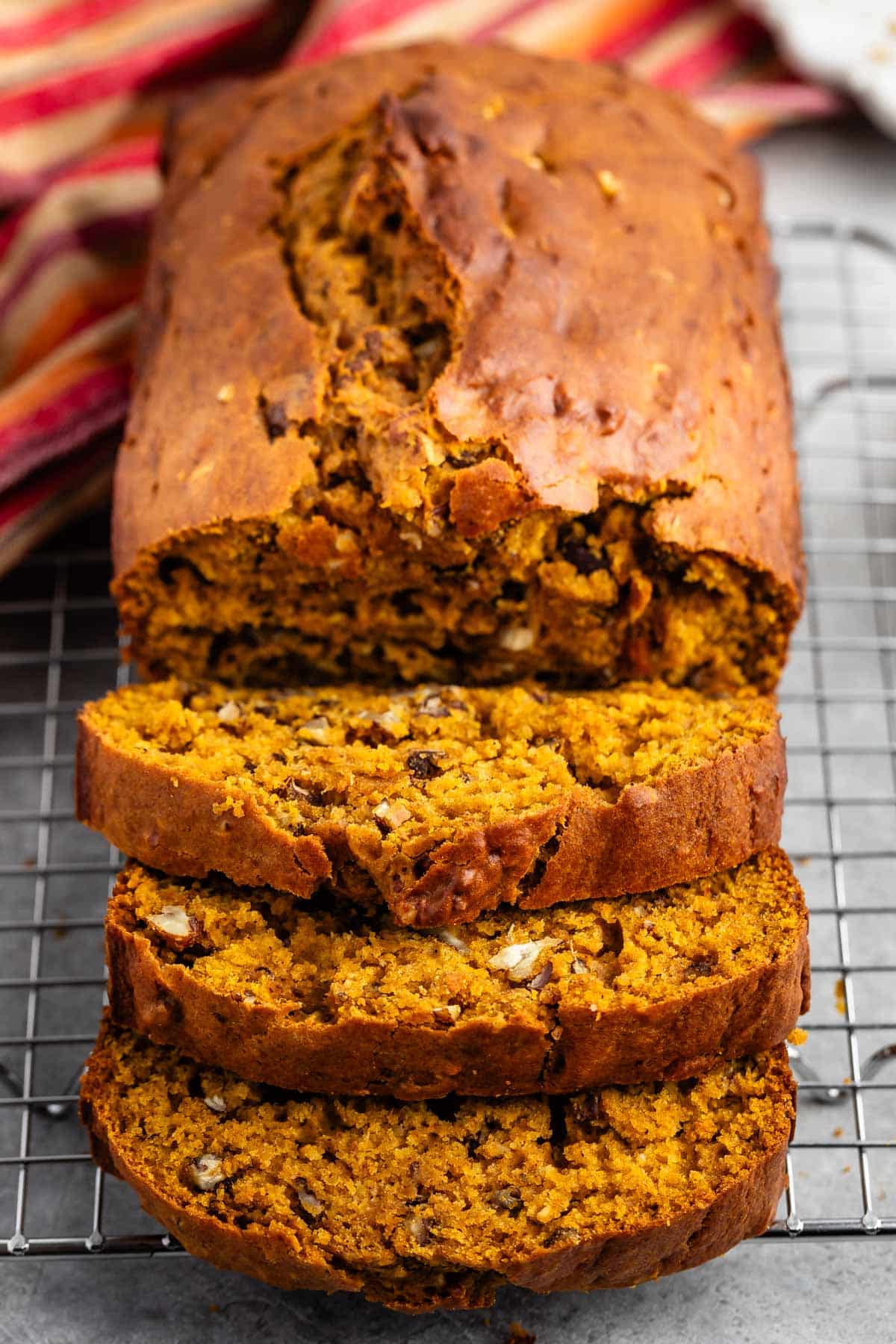 sliced bread on a rack with nuts baked in.