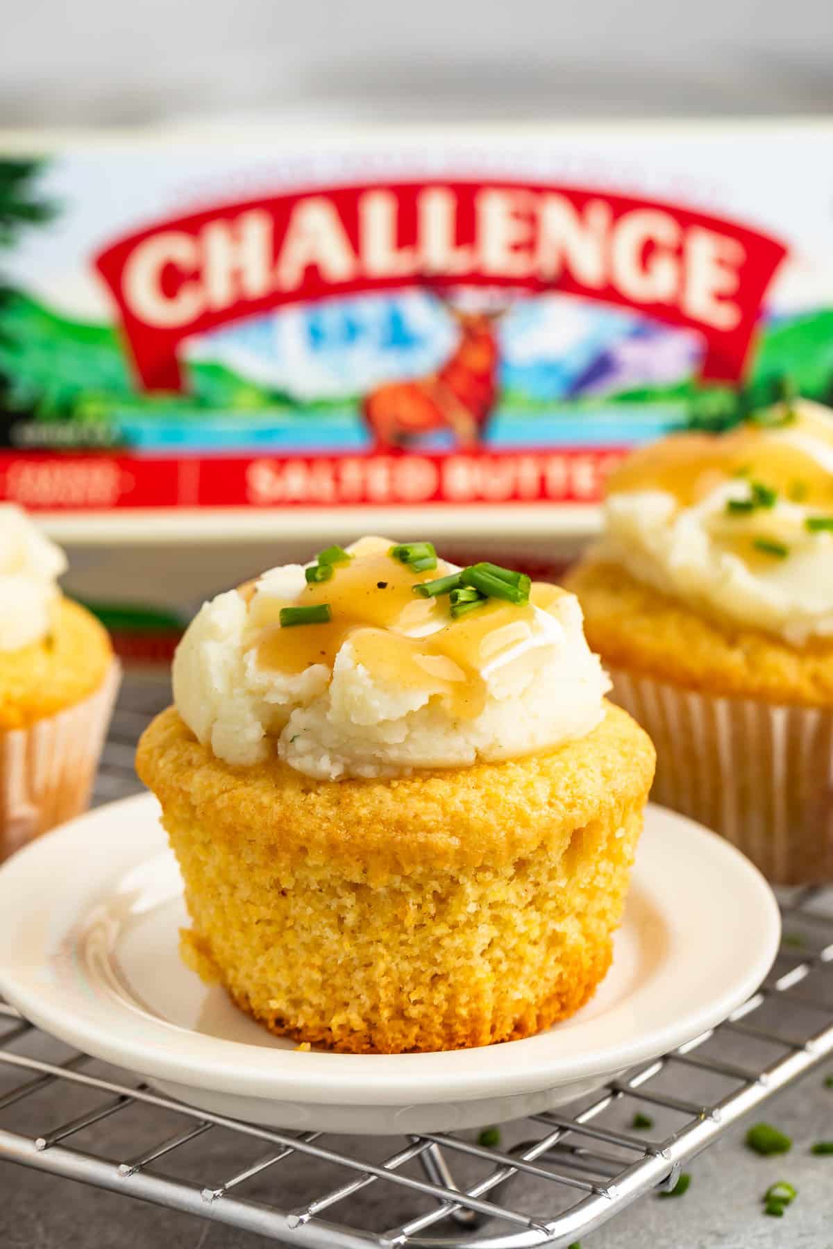 photo showing cupcake with mashed potato frosting and gravy and chives on top