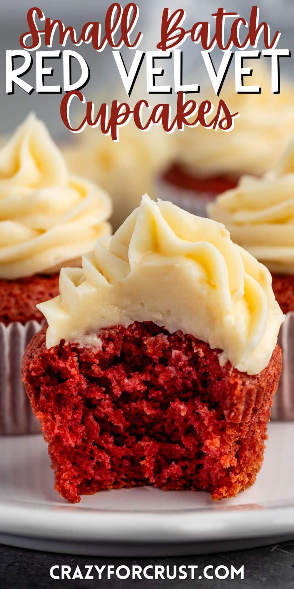 red cupcakes with frosting on top on a white plate with words on the image.
