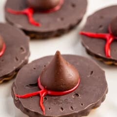 witch hats made with chocolate candy on a white plate.