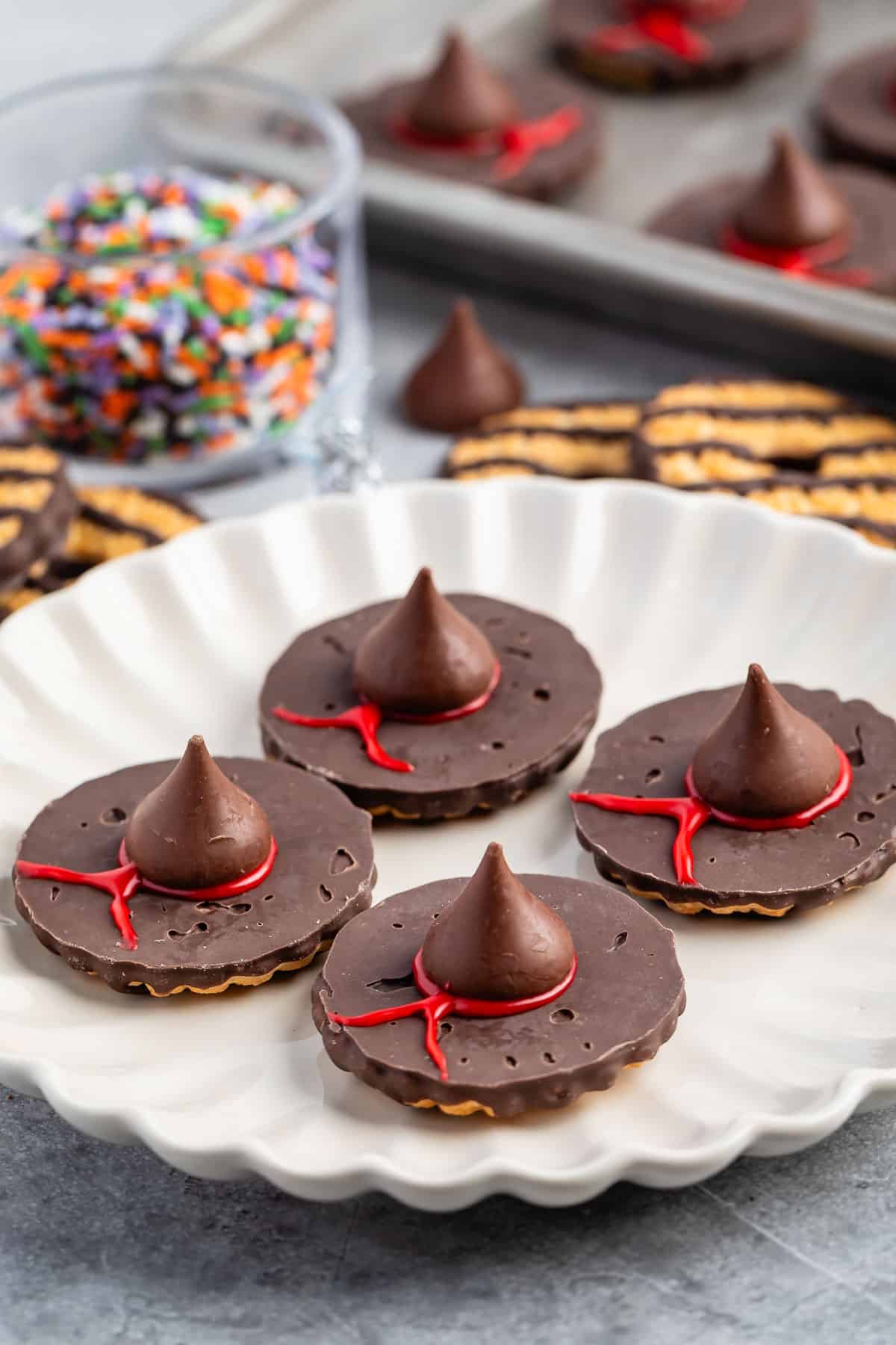 witch hats made with chocolate candy on a white plate.