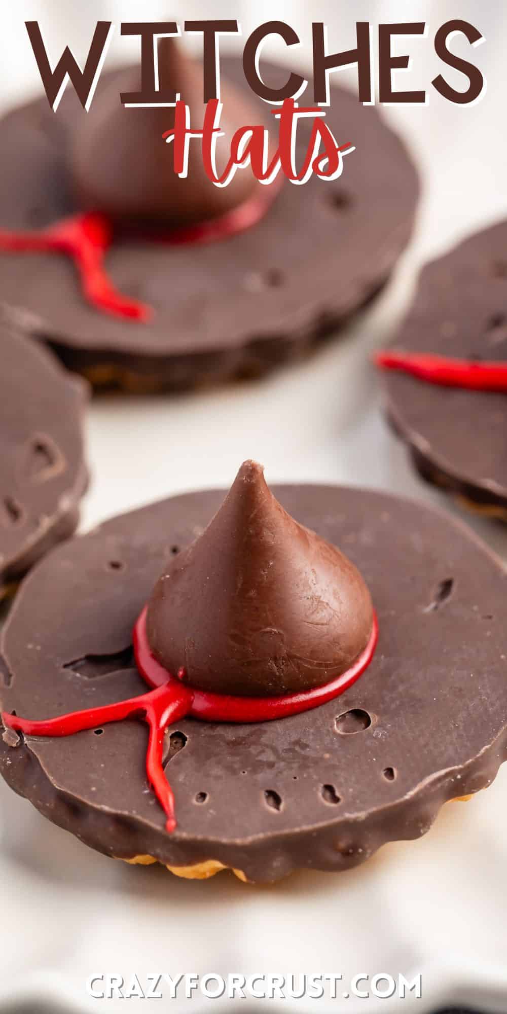 witch hats made with chocolate candy on a white plate with words on the image.