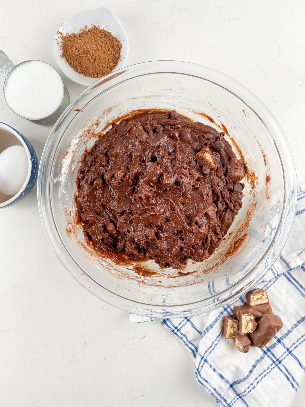 process shot of candy bar brownie pie.