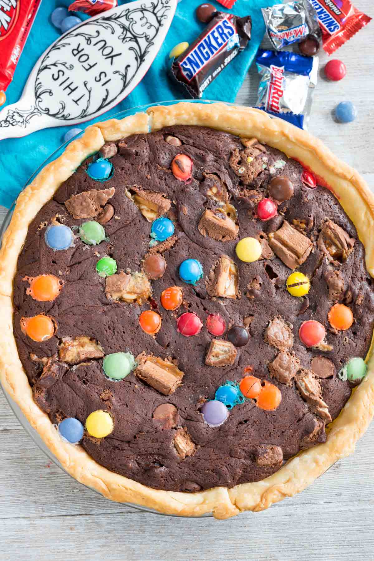 brownie pie with colorful m&ms and candy baked in.