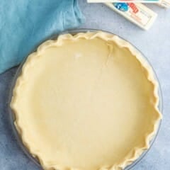 butter pie crust in a clear pan.