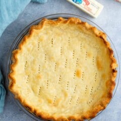 butter pie crust in a clear pan.