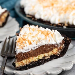 sliced pie with whipped cream and coconut on top.