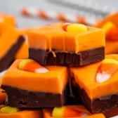 stacked brown and orange fudge with a candy corn on top.