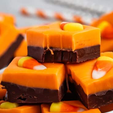 stacked brown and orange fudge with a candy corn on top.