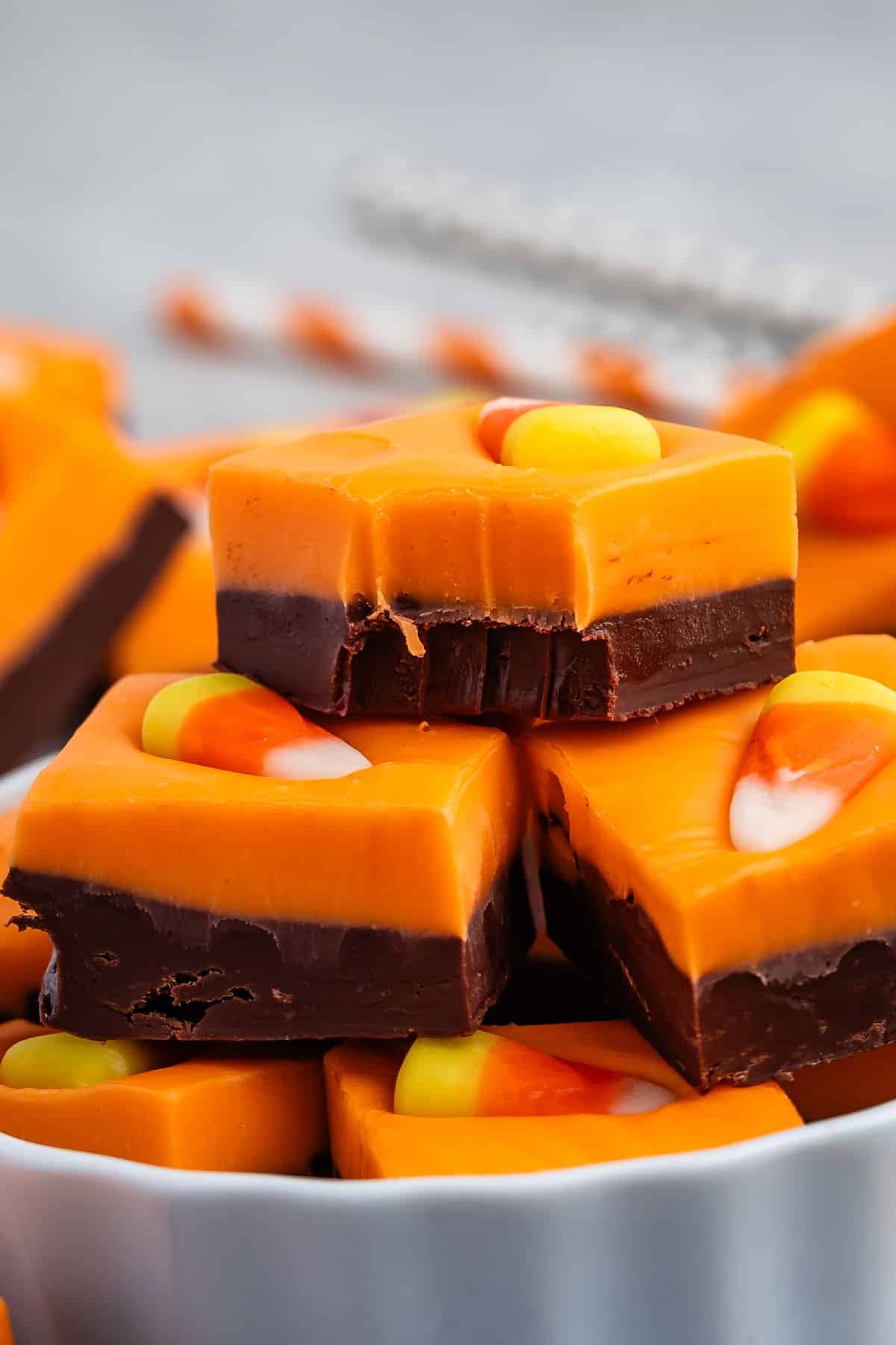 stacked brown and orange fudge with a candy corn on top.