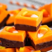 stacked brown and orange fudge with a candy corn on top.