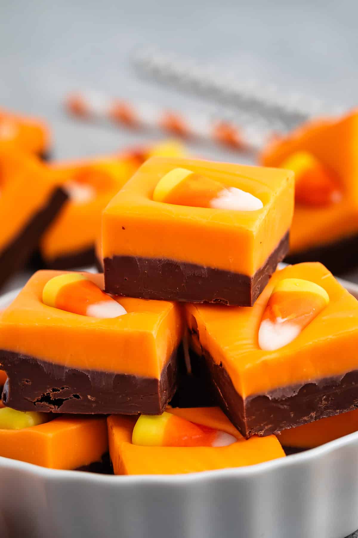 stacked brown and orange fudge with a candy corn on top.
